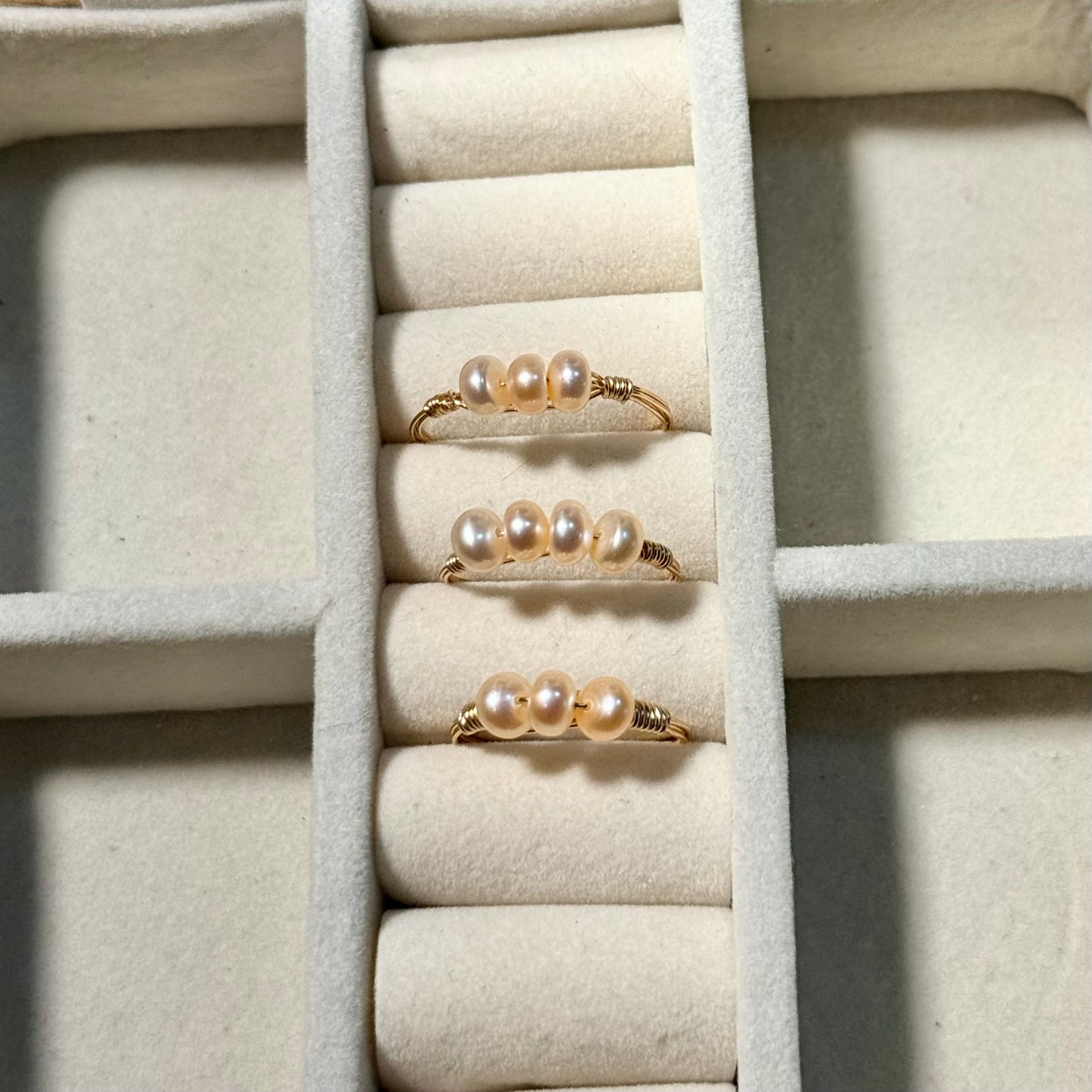 Triple or quadruple pearl ring